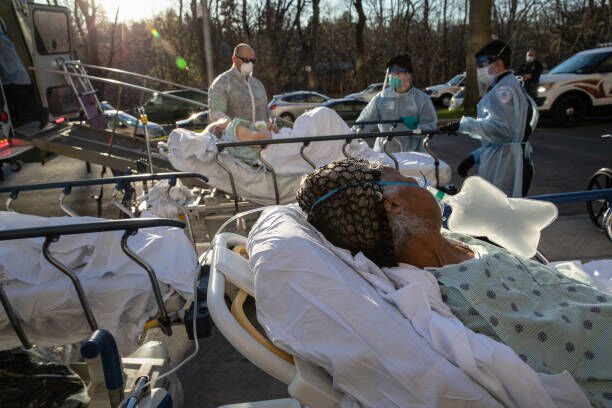 NEW YORK, NY - APRIL 06: (EDITORIAL USE ONLY) COVID-19 patients arrive to the Wakefield Campus of the Montefiore Medical Center on April 06, 2020 in the Bronx borough of New York City. A specialized bus known as a Medical Evacuation Transport Unit (METU), caries patients on stretchers and benches. The patient transfers are designed to help overwhelmed hospitals even out caseloads in Westchester County and New York City at the epicenter of the U.S. coronavirus pandemic. The patients were being transferred from the Einstein Campus, Weilerl Hospital, also a Bronx Montefiore hospital. The transfers are staffed by Empress EMS, Yonkers police and hospital staff on both ends wearing personal protective equipment (PPE). (Photo by John Moore/Getty Images)