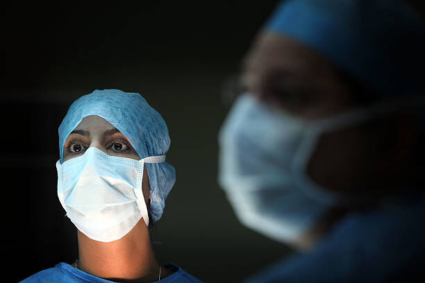 BIRMINGHAM, ENGLAND - MARCH 16: A surgeon and his theatre team perform key hole surgery to remove a gallbladder at at The Queen Elizabeth Hospital on March 16, 2010 in Birmingham, England. As the UK gears up for one of the most hotly contested general elections in recent history it is expected that that the economy, immigration, industry, the NHS and education are likely to form the basis of many of the debates. (Photo by Christopher Furlong/Getty Images)