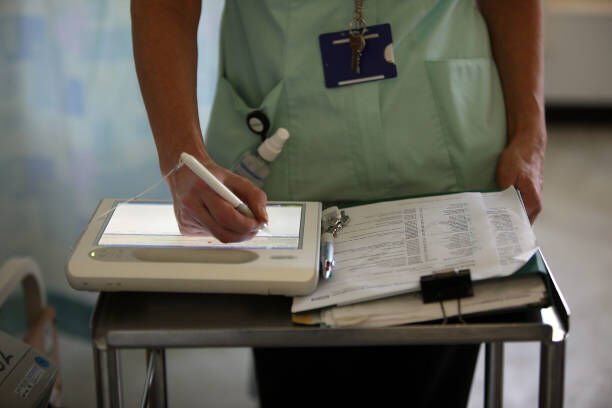 BIRMINGHAM, ENGLAND - MARCH 16: A nurse uses a wireless electronic tablet to order medicines from the pharmacy at The Queen Elizabeth Hospital on March 16, 2010 in Birmingham, England. As the UK gears up for one of the most hotly contested general elections in recent history it is expected that that the economy, immigration, industry, the NHS and education are likely to form the basis of many of the debates. (Photo by Christopher Furlong/Getty Images)