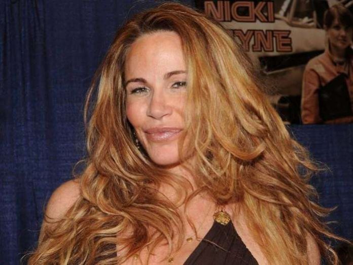 American actress Tawny Kitaen who appeared in “Bachelor Party” and provocative 1980s rock videos, has died in California.