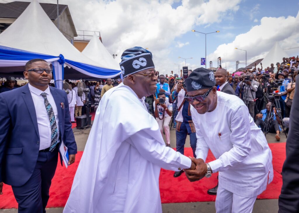 President-elect Bola Ahmed Tinubu exchanges pleasantries with Rivers State Nyesom Wike