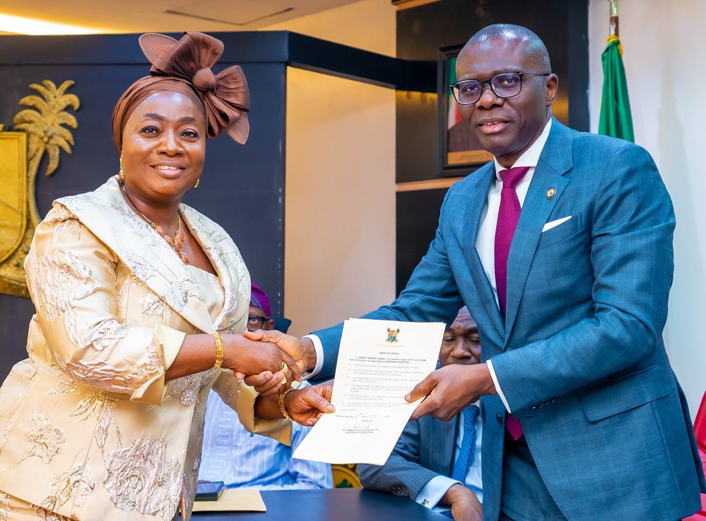 Lagos State Governor, Mr Babajide Sanwo-Olu administers Oath of Office to Mrs Akanbi Adenike Ganiat as Permanent Secretary, Office of Chief of Staff at the Lagos House, Aluasa, Ikeja, on Thursday, 18 May 2023.