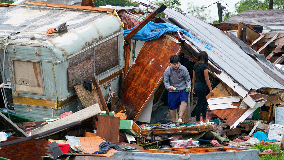 People salvage items from a home after a tornado hit Saturday, May 13, 2023, in the unincorporated community of Laguna Heights, Texas near South Padre Island. Authorities say one person was killed when a tornado struck the southernmost tip of Texas on the Gulf coast. (Photo: AP/Julio Cortez)