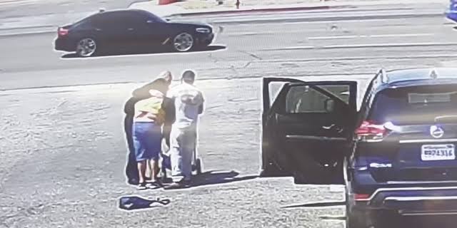 The good Samaritan hugs the helpless mother of the baby in stroller after the rescue