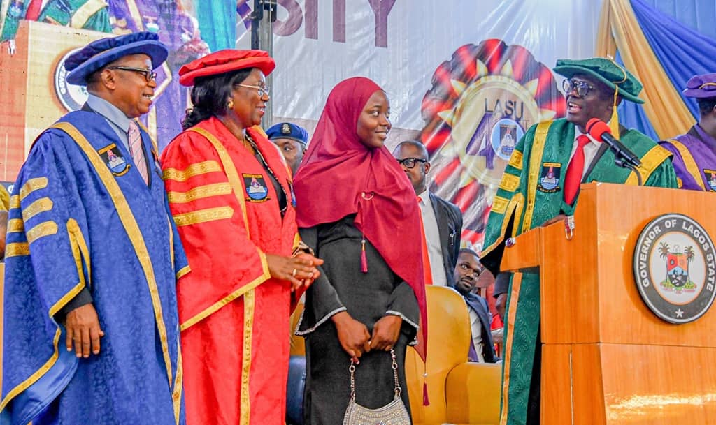 Governor Babajide Sanwo-Olu addressing LASU's best graduating student, Miss Aminat Imoitesemeh Yusuf