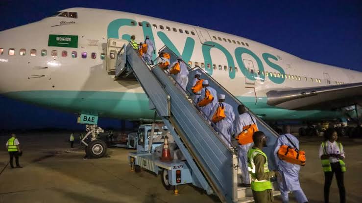 Pilgrims entering a Flynas aircraft en route Saudi Arabia