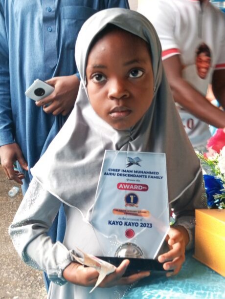 Yusuff Muheebah of Popo-Oba/Oke-Oba, the first prize winner of the Quranic recitation contest (Junior category) with her plaque