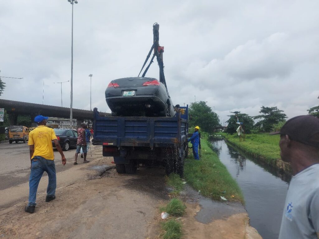 LASEMA officials removing the car from the canal