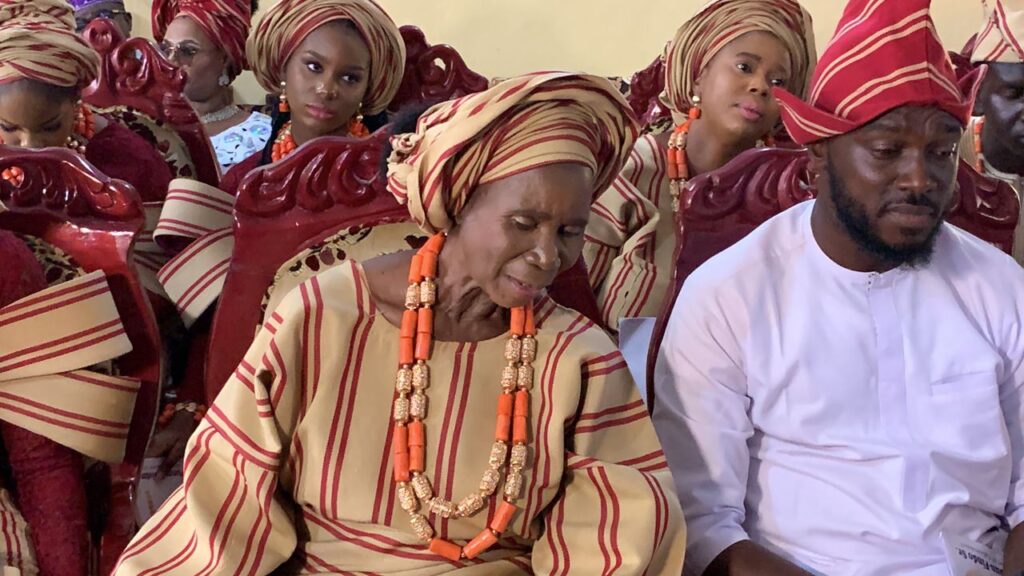 The mother of Otunba Atunluse of Egboroland, Funmi Abiodun-Findo, prays for his son, the new chief, at the conferment ceremony