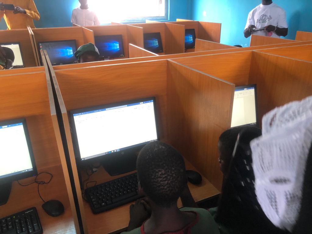 Students of St. John School, Aroloya, accessing the computer systems in the Computer Lab