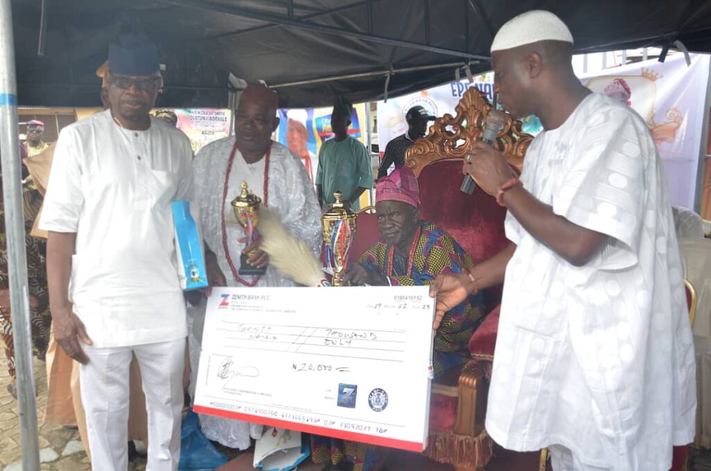 Otunba TJ Abass presenting a cheque of N20,000, which was donated by Oloja-elect of Lagos, Abiola Kosoko, to the Olu-Epe of Epe Kingdom, His Royal Majesty, Oba Dr Shefiu Adewale