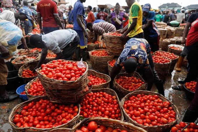 People buy and sell vegetables at Mile 12 International Market in Lagos, Nigeria May 13, 2022. (Photo: REUTERS/Temilade Adelaja)