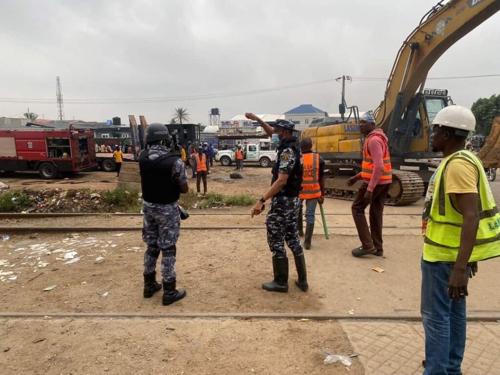 Lagos State Task Force members clearing the Fagba rail tracks of Shanties