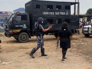 Lagos State Task Force members clearing the Fagba rail tracks of Shanties