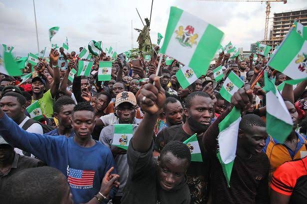 File photo: Youths waving the Nigerian flag