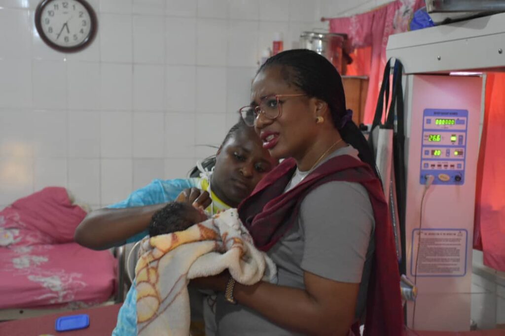 Mandate Secretary of FCT HSES, Dr Adedolapo Fasawe, with a mother, Joyce Emmanuel, at the Gwarinpa General Hospital