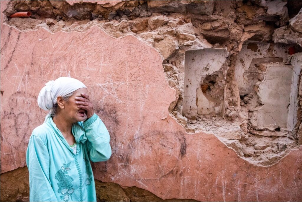 A woman reacts standing in front of her earthquake-damaged house. Fadel Senna/AFP/Getty Images