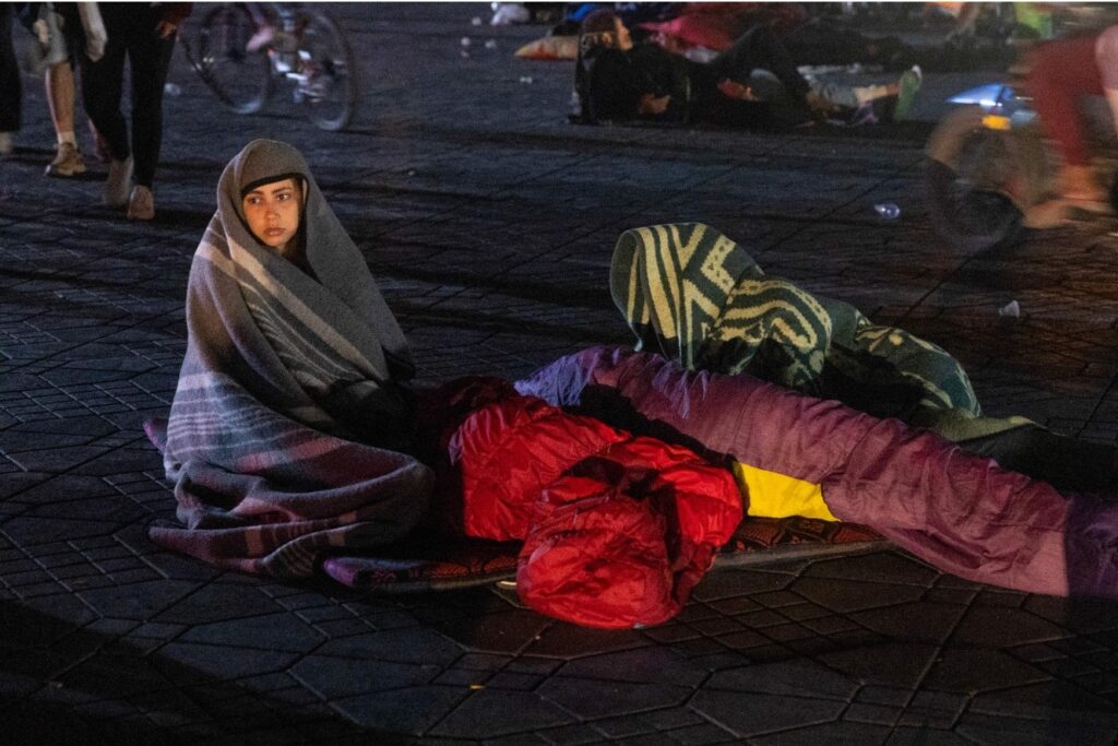 Residents take shelter outside at a square. Fadel Senna/AFP/Getty Images