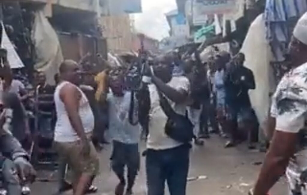 Screenshot of a clip showing Inspector Istifanus Kwanchi shoot into the air