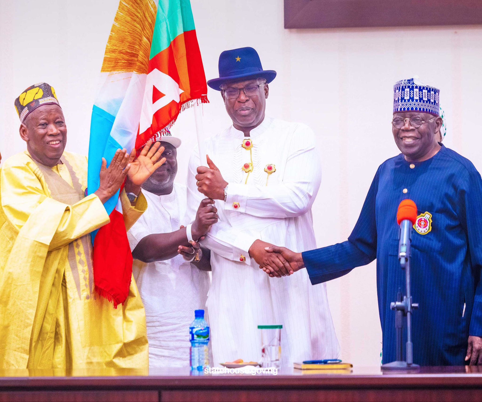 President Bola Tinubu hands the APC flag to the party's governorship candidate in Bayelsa State, Chief Timipre Sylva
