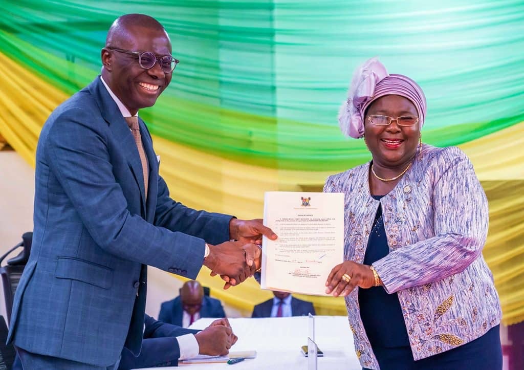 l-r: Governor of Lagos State, Mr. Babajide Sanwo-Olu presenting the Oath of Office to Mrs. Motilayo Iyabo Seriki-Bello as Permanent Secretary, Teaching Service Commission (TESCOM), during her swearing-in ceremony at the Lagos House, Alausa, Ikeja, on Friday, 03 November 2023.