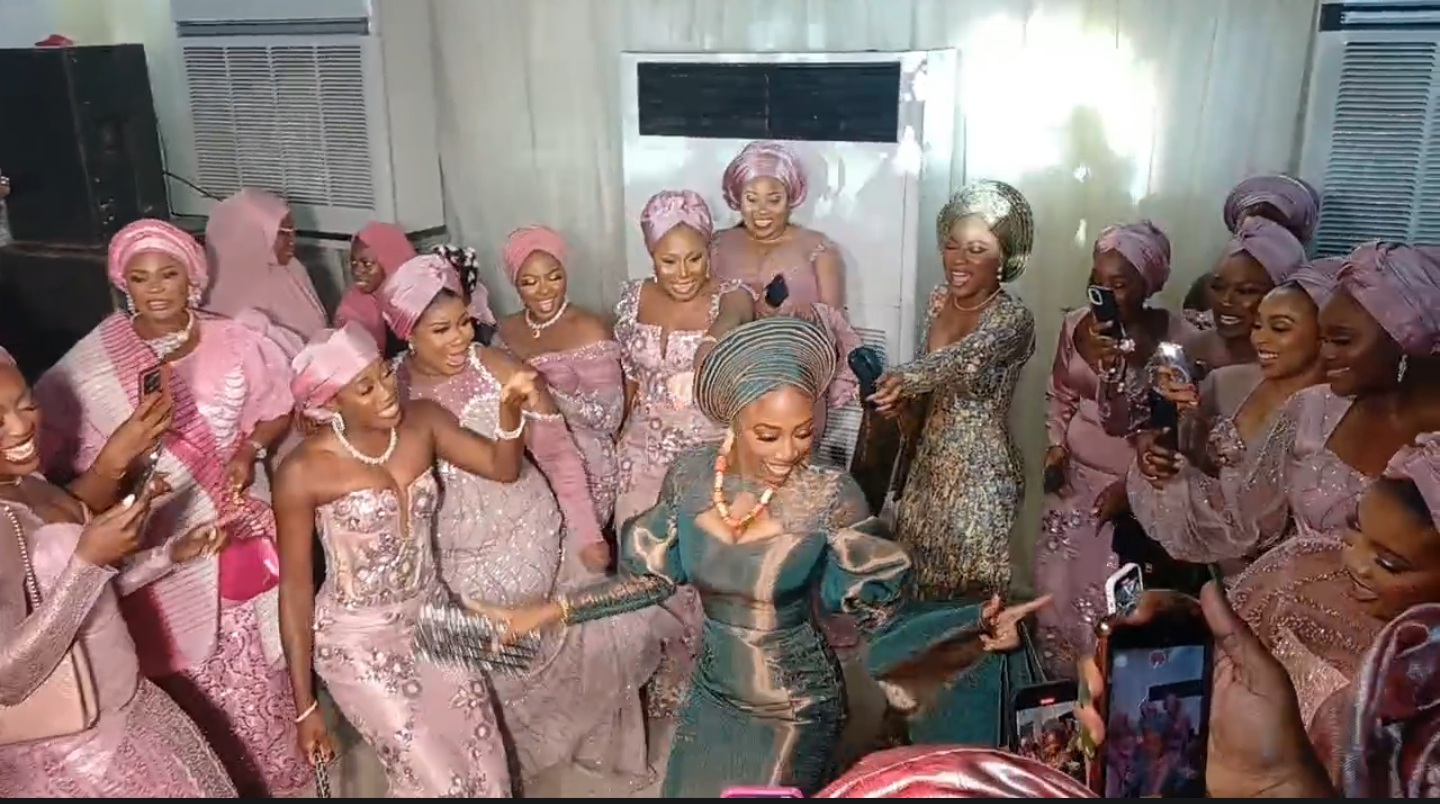 Olayemi Hafsat Lawal dancing into the venue of traditional wedding ceremony with her friends