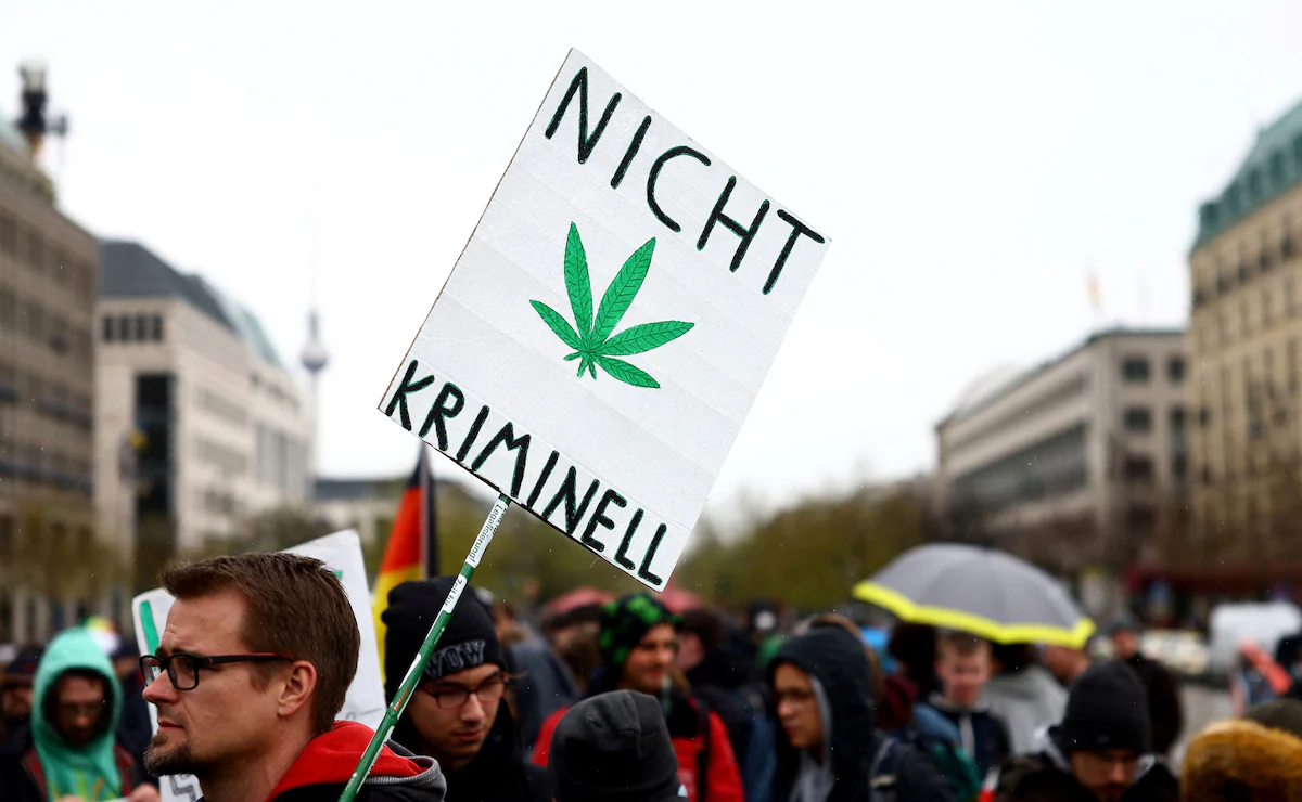 A man carries a sign reading “Not criminal” as he participates in a gathering with marijuana activists in Berlin this year to call for the legalization of marijuana in Germany. (Lisi Niesner/Reuters)