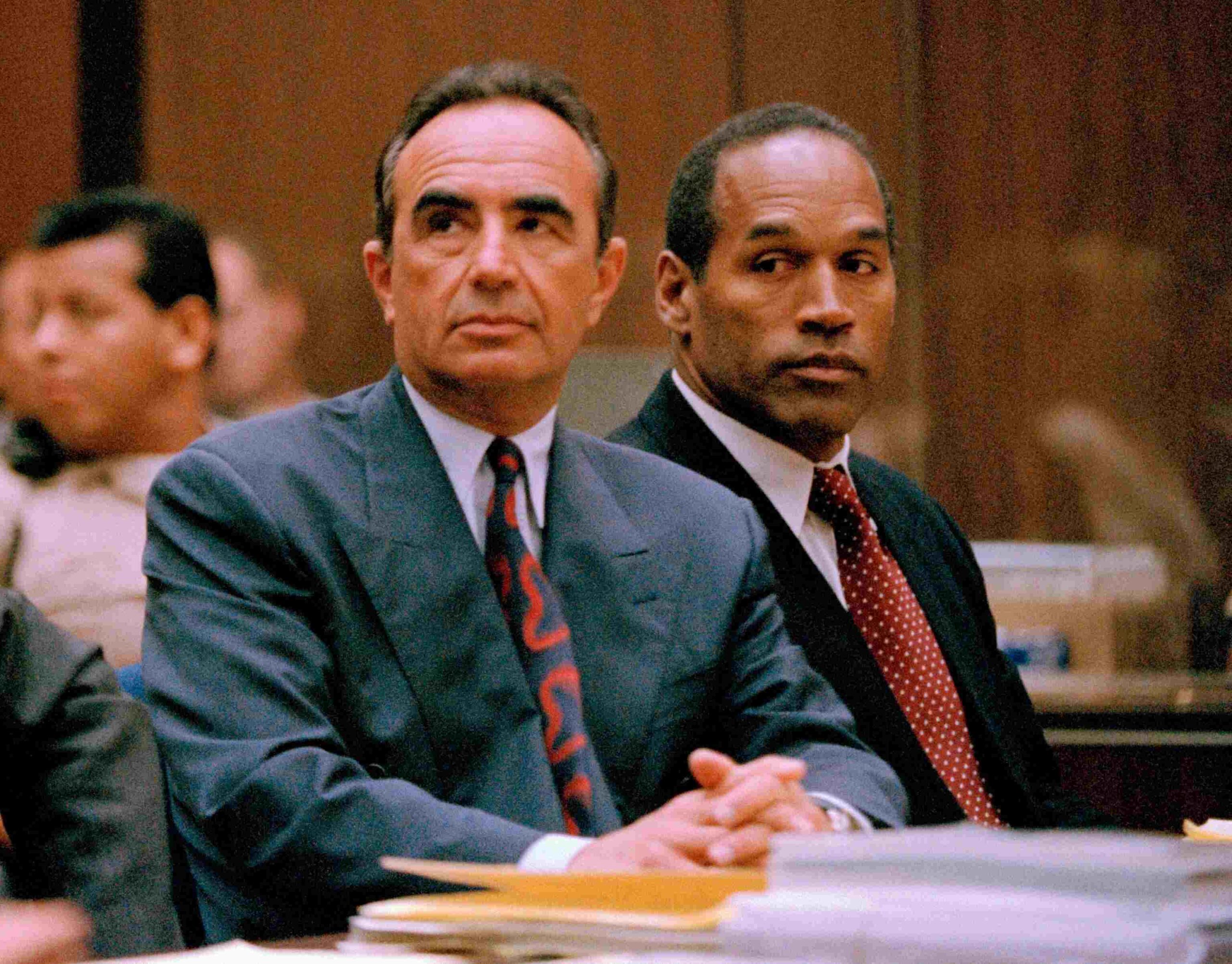 O. J. Simpson (R) appears with his attorney Robert Shapiro in Los Angeles County Superior Court for his preliminary hearing in Los Angeles, June 30, 1994.(Photo: Newsbase/AP, FILE)