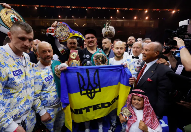 Oleksandr Usyk celebrates with the belts after winning the fight to become the undisputed heavyweight world champion (Photo: Andrew Couldridge/Action Images via Reuters)