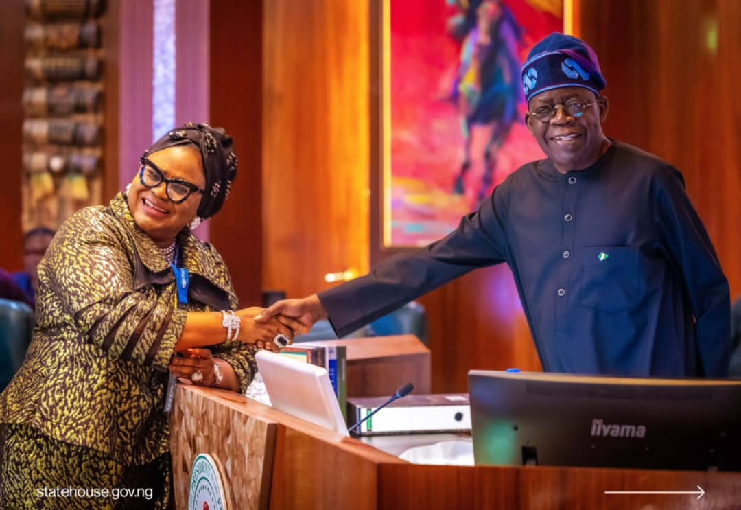 NPC Commissioner, Olayinka Saidat Oladunjoye exchanging pleasantries with President Bola Tinubu at her inauguration ceremony