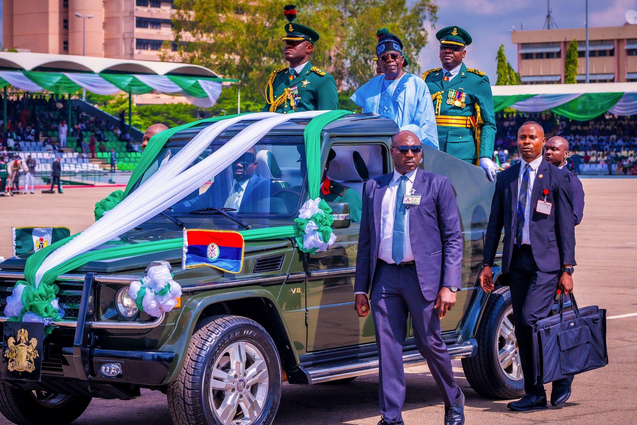 President Bola Tinubu inspecting the Democracy Day parade moments after he fell while trying to get inside the vehicle (Photo: Presidency Nigeria/X)