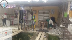 Lagos enforcement officials removing structures on Ajiran-Regional road Collector drain in Eti-Osa LG to prevent flooding