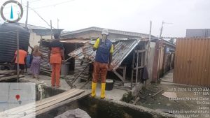 Lagos enforcement officials removing structures on Ajiran-Regional road Collector drain in Eti-Osa LG to prevent flooding