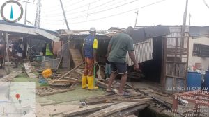 Lagos enforcement officials removing structures on Ajiran-Regional road Collector drain in Eti-Osa LG to prevent flooding