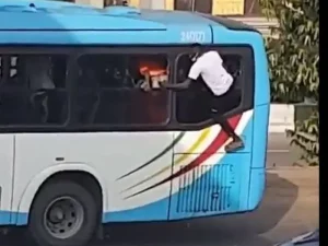 An unknown person on the window of a BRT bus at the scene of thugs' attack on #EndSARS protesters in October 2020