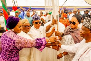 Oba Abdulhakeem Babatunde Olokodana, the first Alakodo of Akodo holding his staff of office