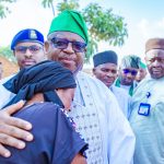 Plateau State Governor Caleb Mutfwang consoles a Bokkos resident who lost family members in a militia attack in April