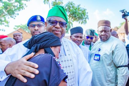 Plateau State Governor Caleb Mutfwang consoles a Bokkos resident who lost family members in a militia attack in April