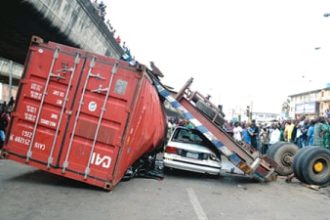 Truck Overturns, Crushes Police Officer and Passenger in Lagos