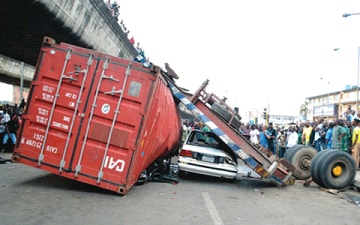Truck Overturns, Crushes Police Officer and Passenger in Lagos