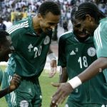 Nigeria striker Obafemi Martins, left, celebrates together with Osaze Odenwengie, second left, Christopher Obodo and Nwankwo Kanu in Abuja, Nigeria, Saturday Oct. 8 2005 during their World Cup 2006 qualifying match against Zimbabwe. Nigeria beat Zimbabwe 5-1 but still missed out on qualifying for the 2006 World Cup finals Saturday. (AP Photo/George Osodi)