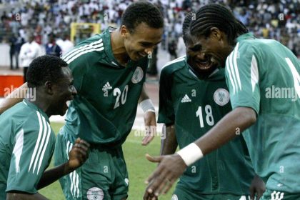 Nigeria striker Obafemi Martins, left, celebrates together with Osaze Odenwengie, second left, Christopher Obodo and Nwankwo Kanu in Abuja, Nigeria, Saturday Oct. 8 2005 during their World Cup 2006 qualifying match against Zimbabwe. Nigeria beat Zimbabwe 5-1 but still missed out on qualifying for the 2006 World Cup finals Saturday. (AP Photo/George Osodi)