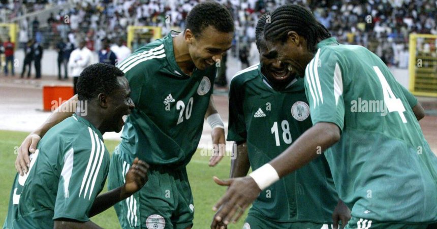 Nigeria striker Obafemi Martins, left, celebrates together with Osaze Odenwengie, second left, Christopher Obodo and Nwankwo Kanu in Abuja, Nigeria, Saturday Oct. 8 2005 during their World Cup 2006 qualifying match against Zimbabwe. Nigeria beat Zimbabwe 5-1 but still missed out on qualifying for the 2006 World Cup finals Saturday. (AP Photo/George Osodi)