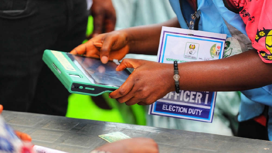 File photo of an INEC official operating BVAS which helps to upload election results to IReV