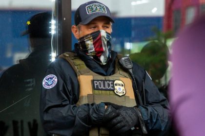 File photo of a masked ICE agent