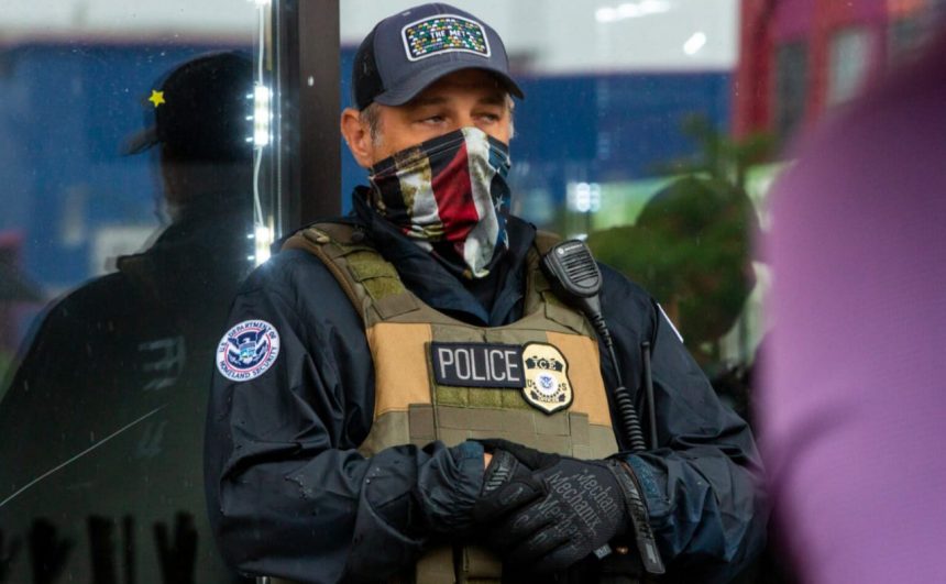 File photo of a masked ICE agent