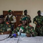 Brigadier General Denis N'Canha (Middle), head of the military office of the presidency gives a press conference at the General Staff of the Armed Forces on November 26, 2025. (Photo: MEINHARDT / AFP)