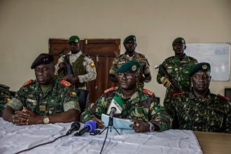 Brigadier General Denis N'Canha (Middle), head of the military office of the presidency gives a press conference at the General Staff of the Armed Forces on November 26, 2025. (Photo: MEINHARDT / AFP)