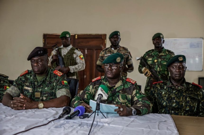Brigadier General Denis N'Canha (Middle), head of the military office of the presidency gives a press conference at the General Staff of the Armed Forces on November 26, 2025. (Photo: MEINHARDT / AFP)