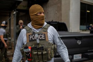 File photo of a masked ICE agent